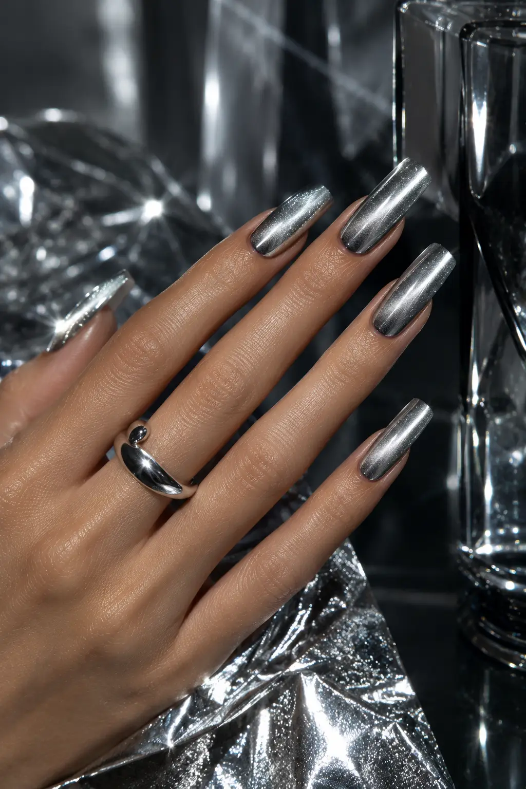 Silver chrome cat eye nails with reflective liquid-metal shine