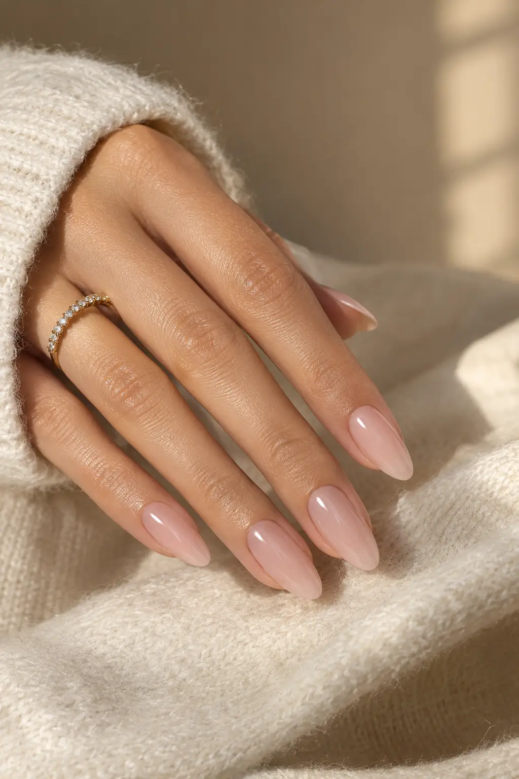 Milky pink Korean nails with a glossy finish on medium almond-shaped nails.