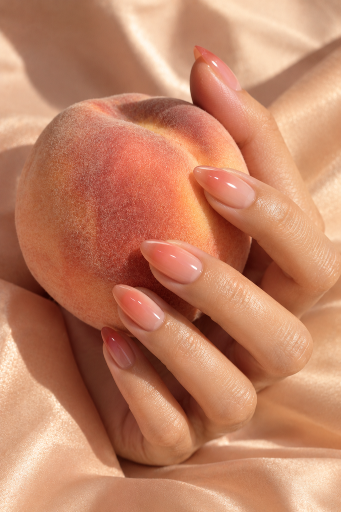 Peach and rose Korean syrup nails with a soft translucent gradient.