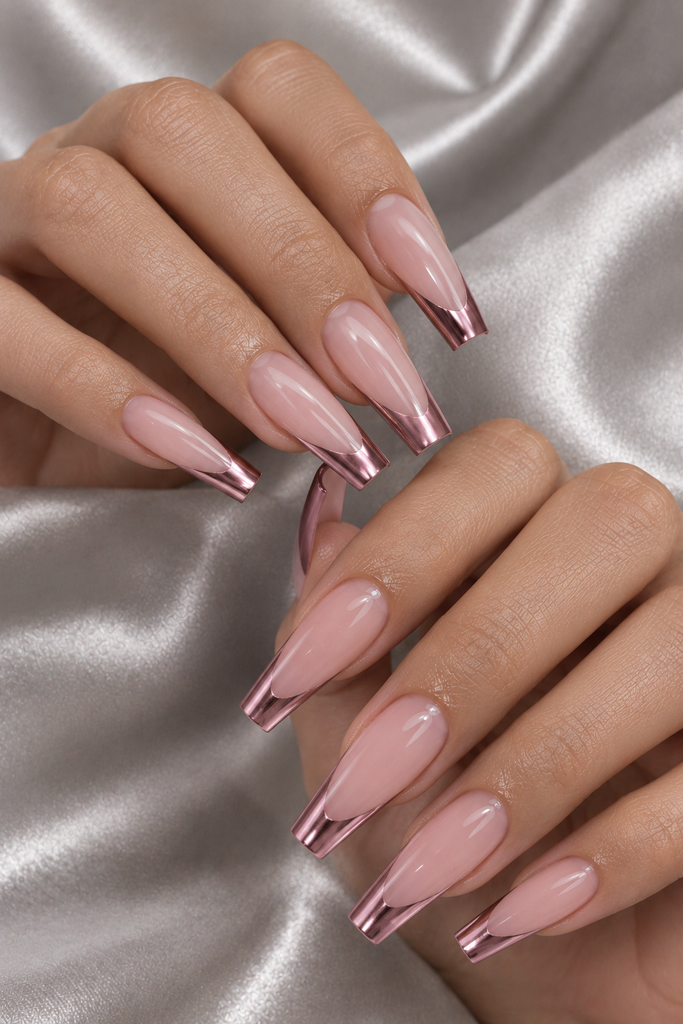 Long coffin nails with sheer pink bases and metallic rose-pink French tips.